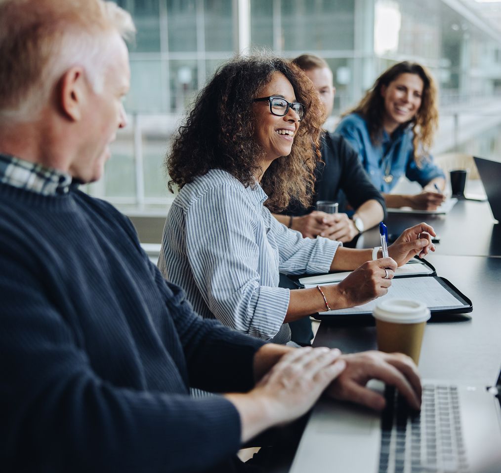 A team of professionals having a productive and engaging meeting in a modern office A team of professionals having a productive and engaging meeting in a modern office